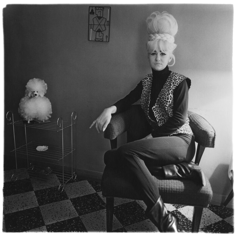 Diane Arbus, Lady bartender at home with a souvenir dog, New Orleans, La. 1964.
